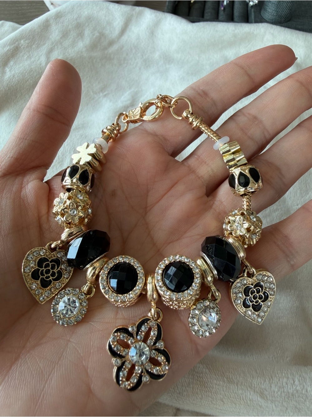 Gold-Tone Bracelet with Black Crystal and Clear Rhinestone Charms
